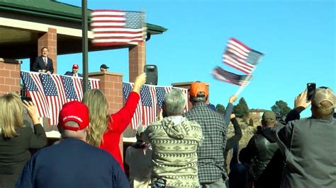 Hundreds protest at Colorado Springs gun store against Trump's removal from state ballot